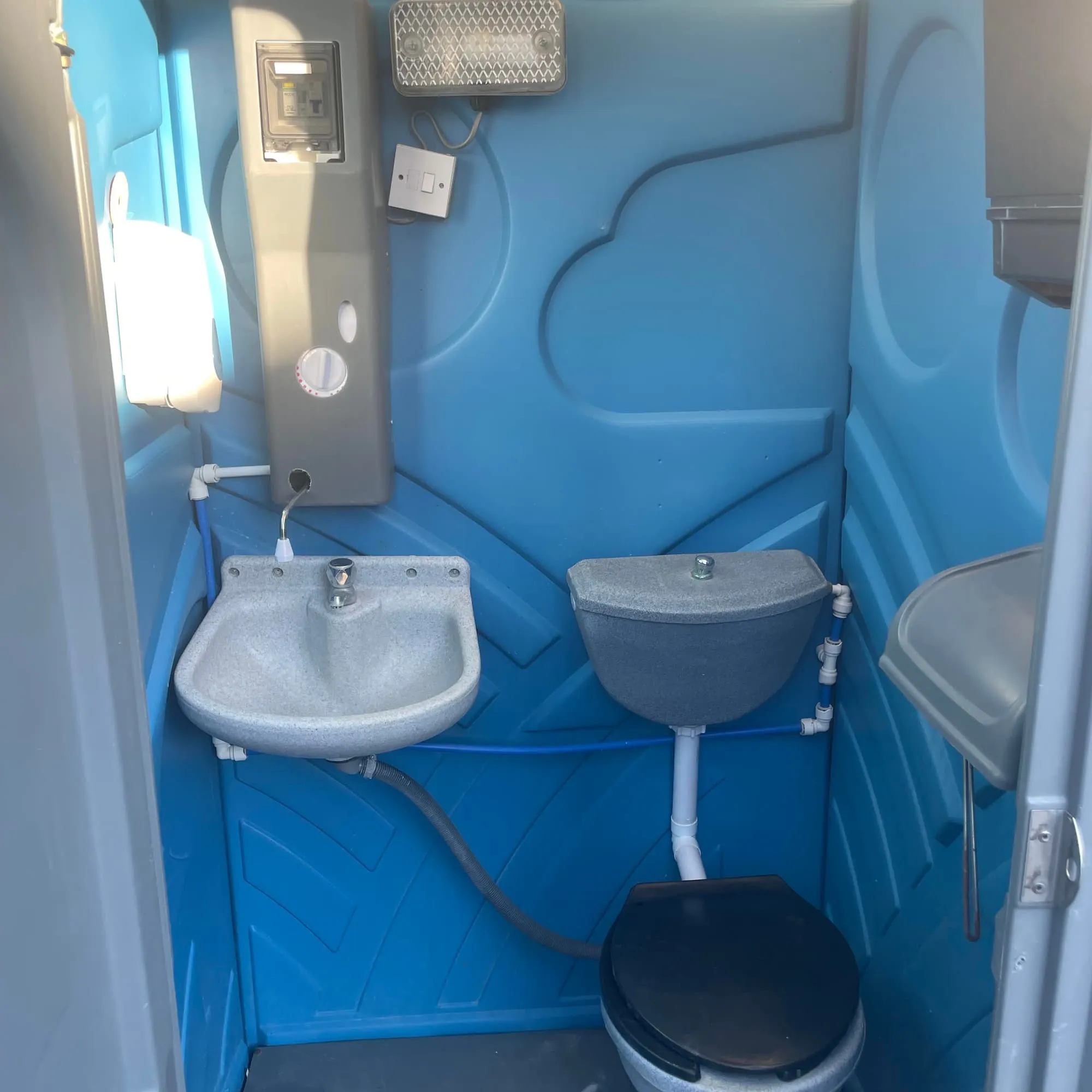 240V Mains Portable Toilet Hire | Hot Water & Lighting