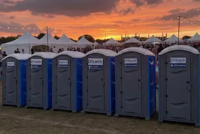 Outdoor event sanitation guide London scene with luxury toilet trailers in Hyde Park