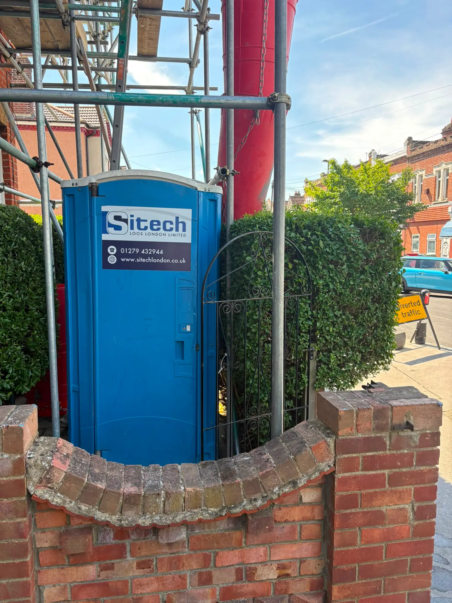 Sitech portable toilet on a scaffolded terraced street job in London